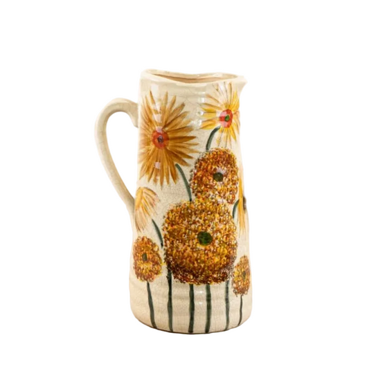 Tall ceramic pitcher with a sunflower botanical illustration and cream crackle glaze finish.