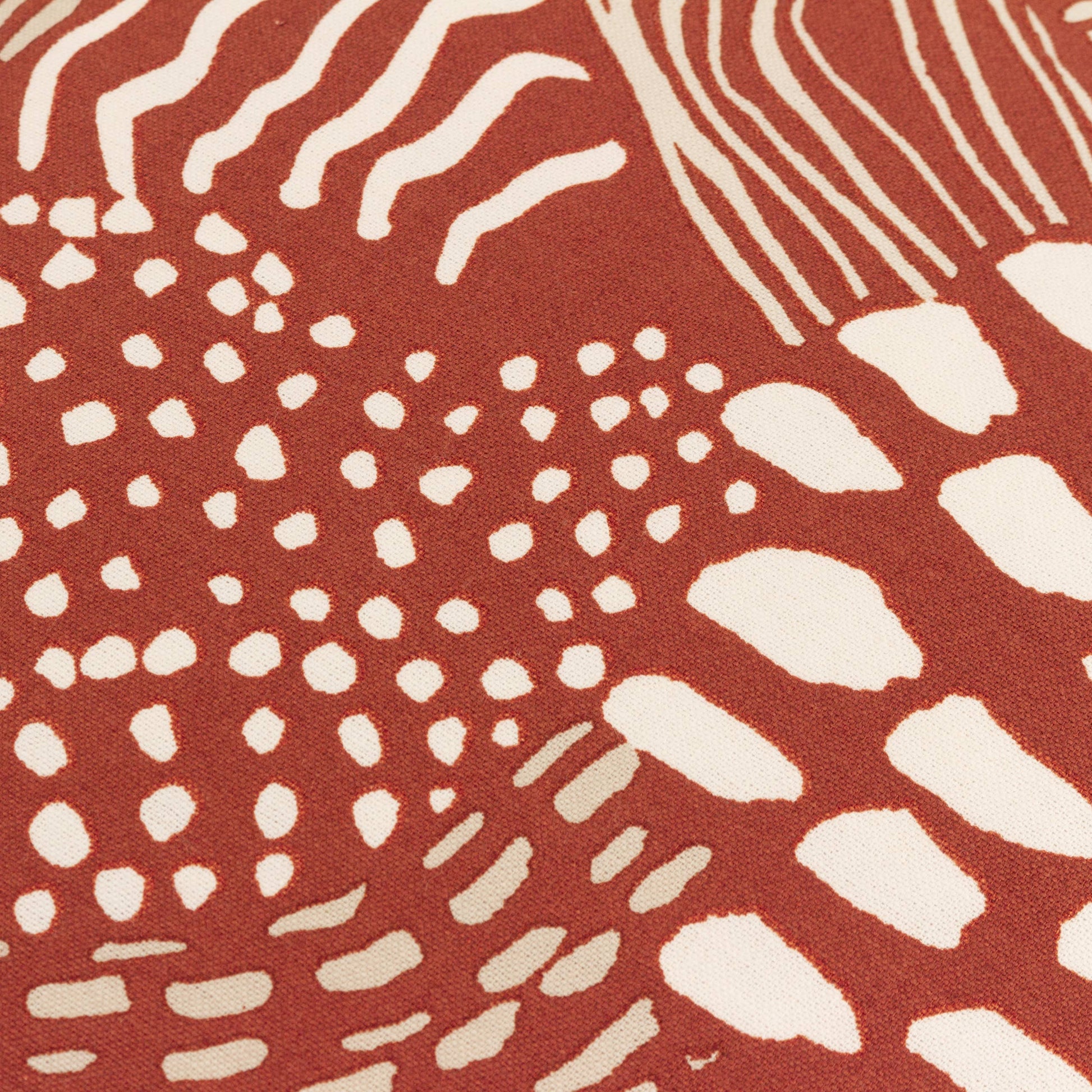 Close up of the Nola minimalist geometric cushion with an abstract art print on neutral 100% cotton fabric.