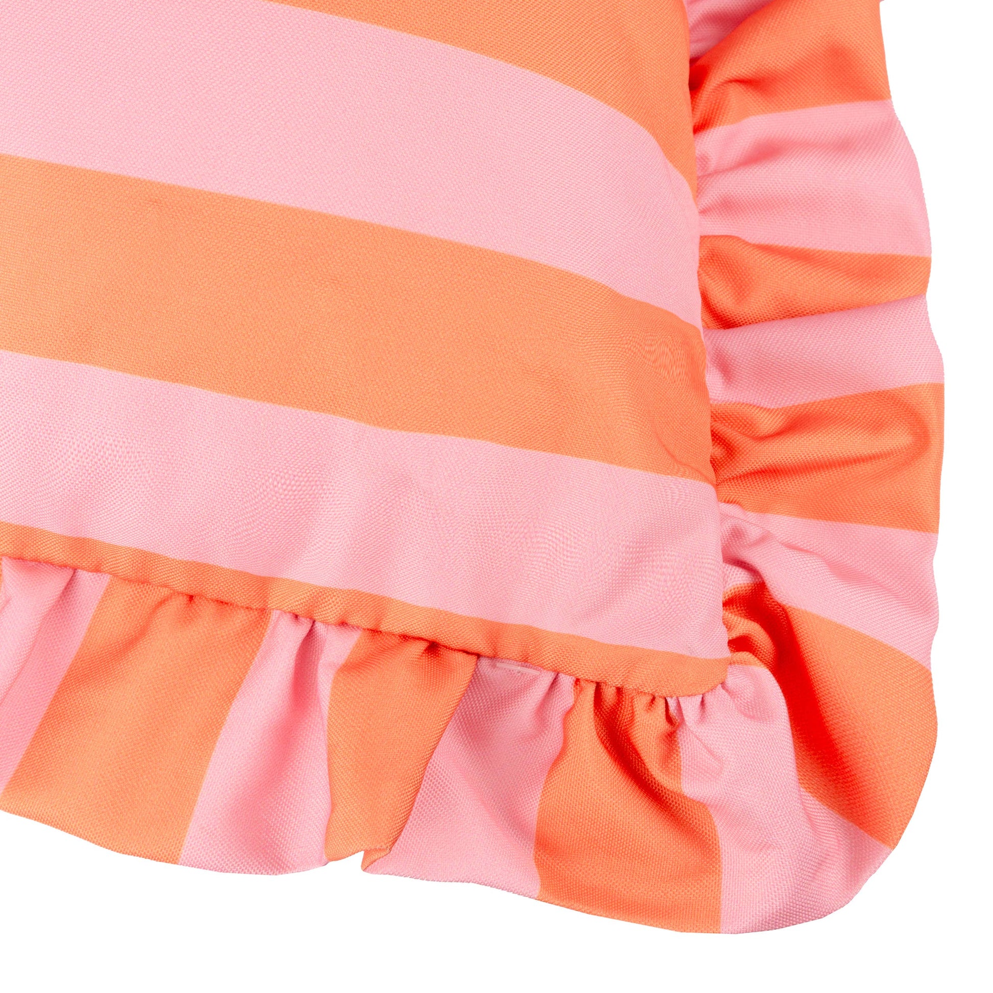 Close up of the Palm Royale outdoor cushion with a bold orange and pink cabana stripe and a decorative ruffle frill edge