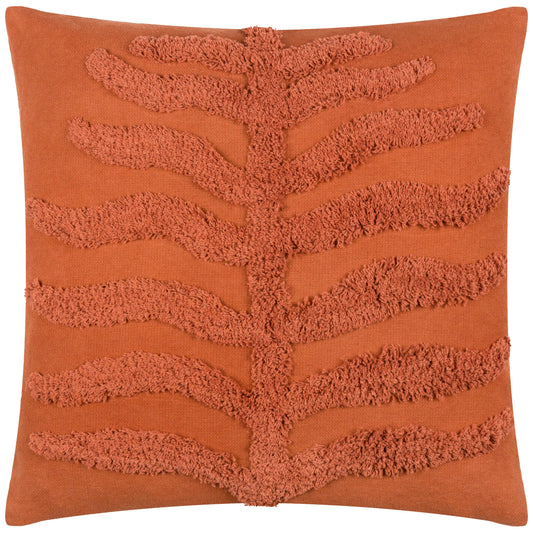 Orange boho tufted cushion with textured leaf design on a white background