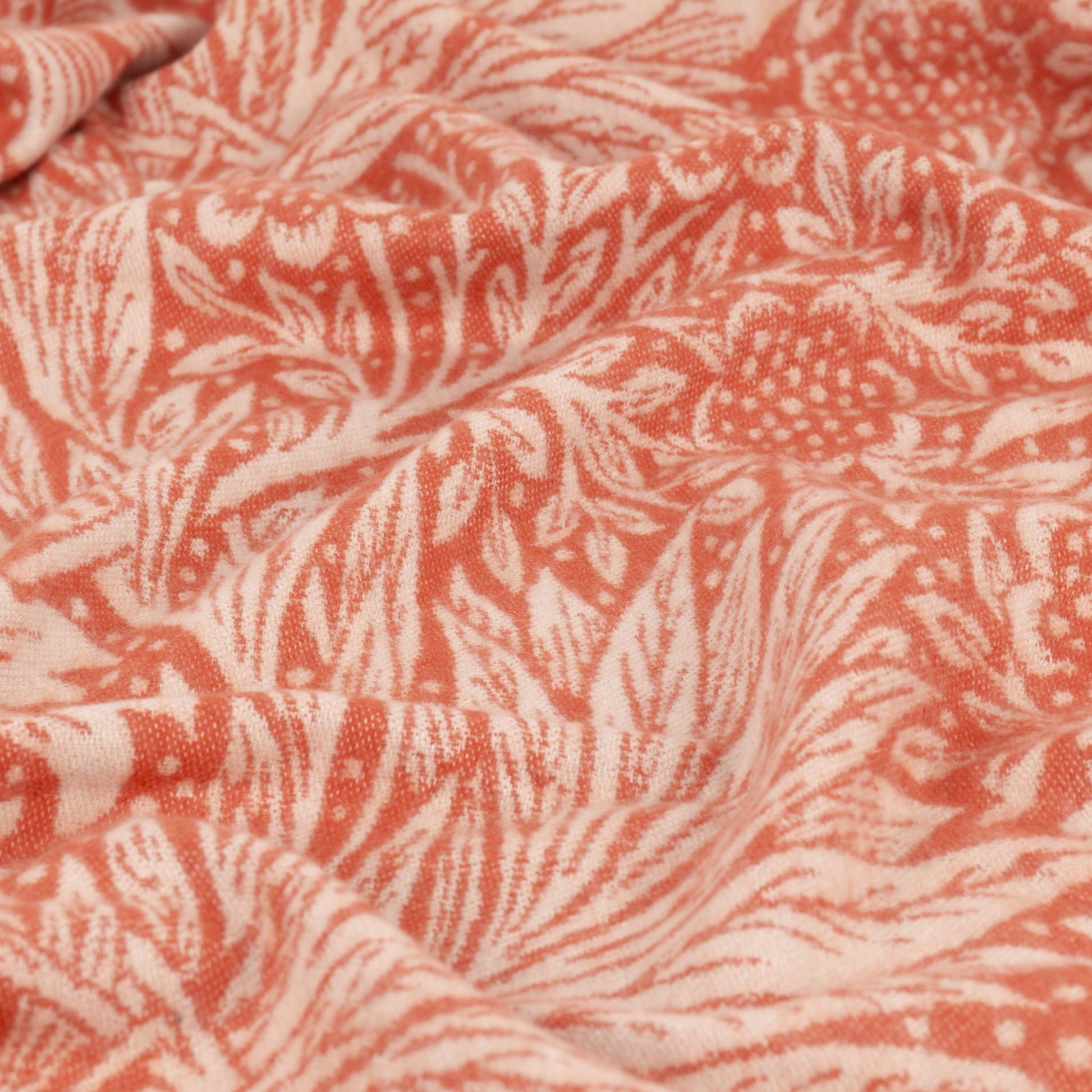 Close up of Marigold William Morris throw featuring a traditional foliage jacquard weave on soft faux mohair fabric.