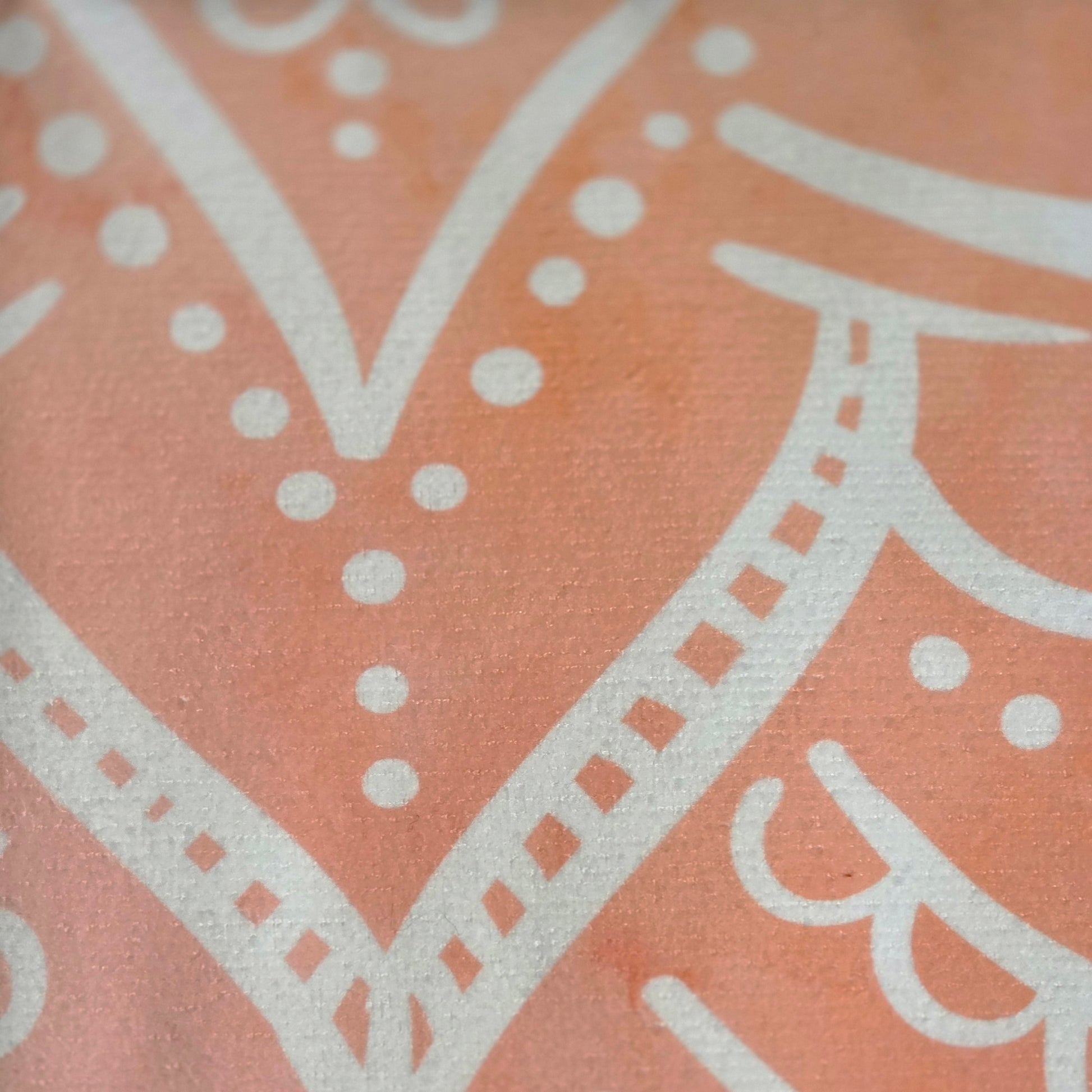Close up of orange mandala beach towel