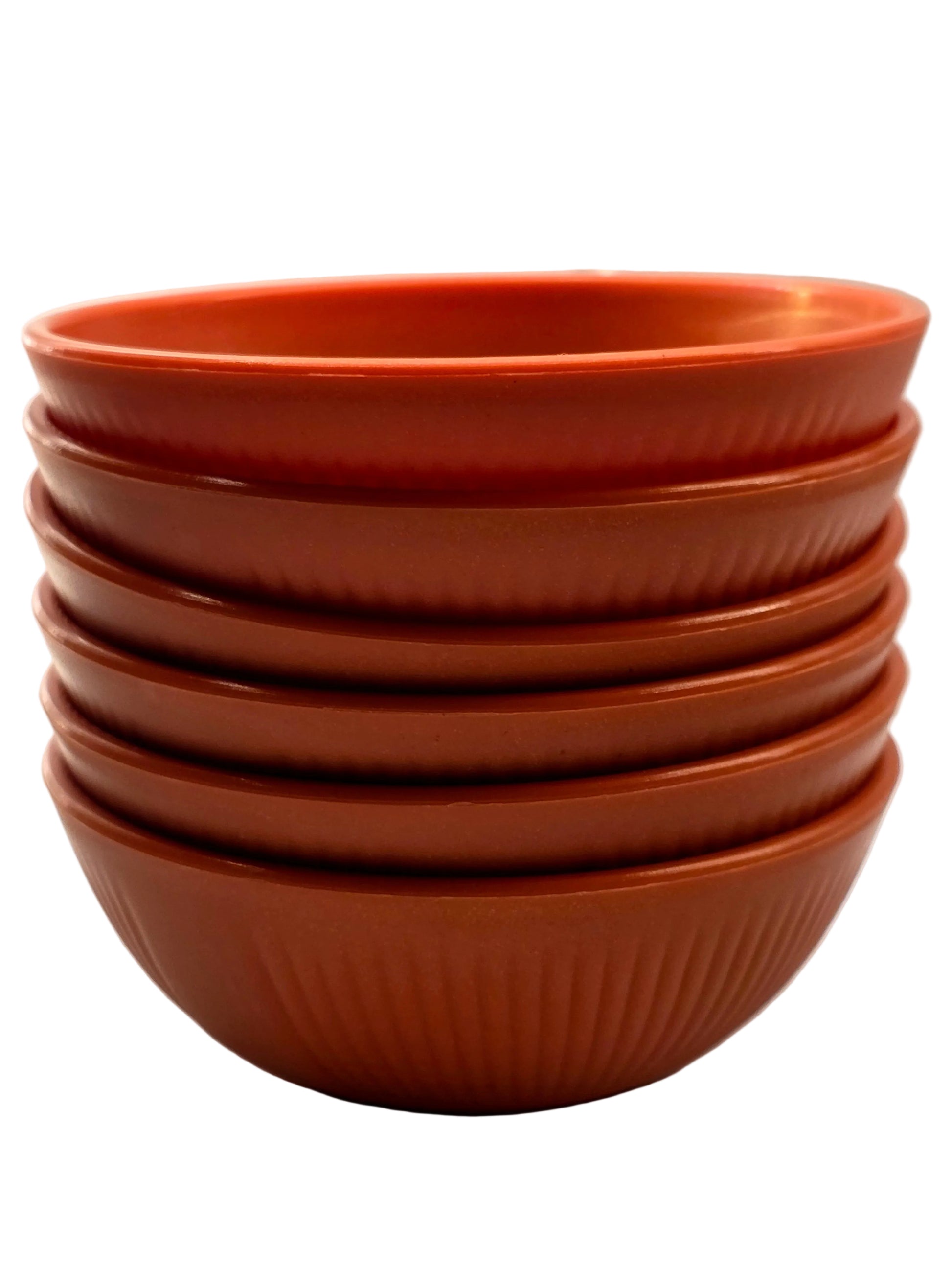 Stack of terracotta-colored bowls on a white background